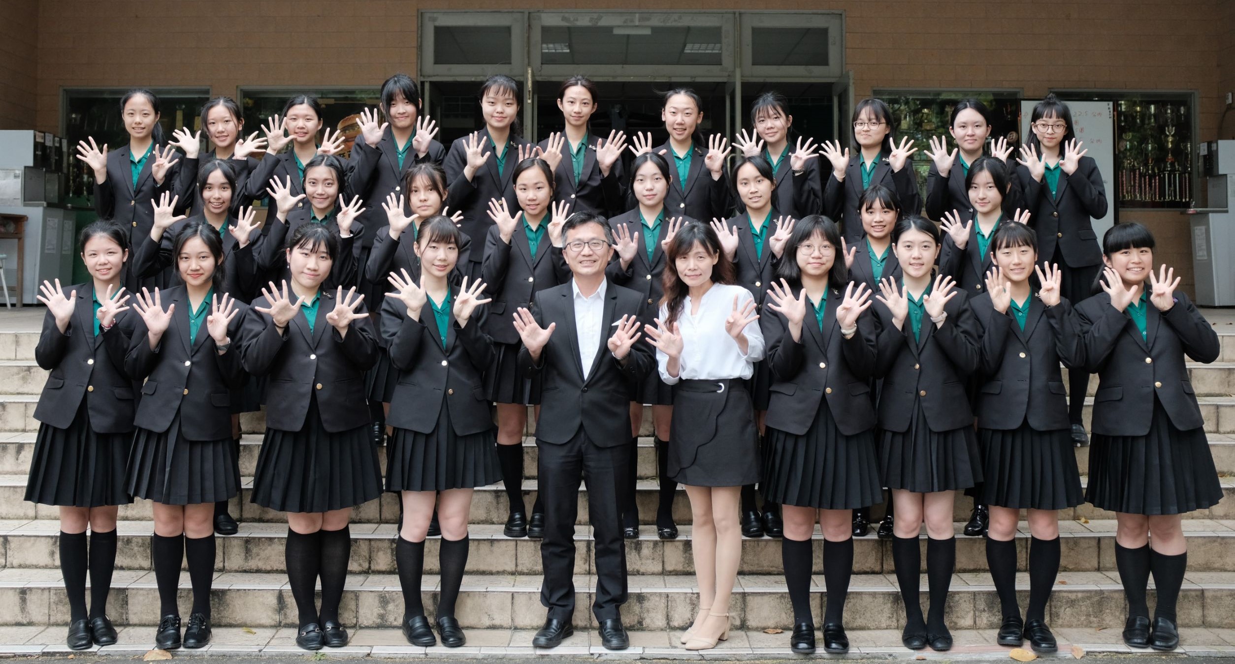 Principal taking photos with students